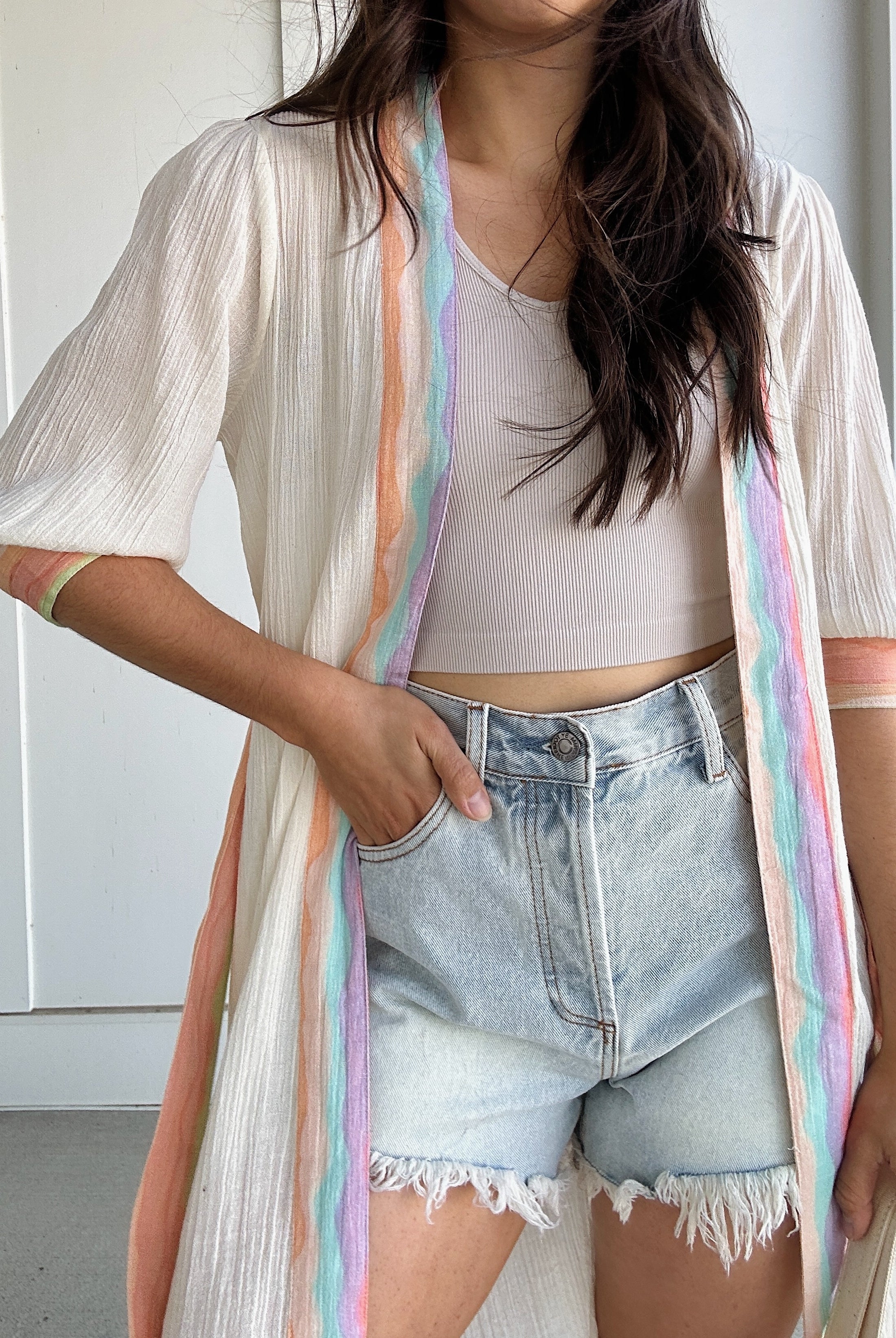 woman wearing duster with colorful stripes