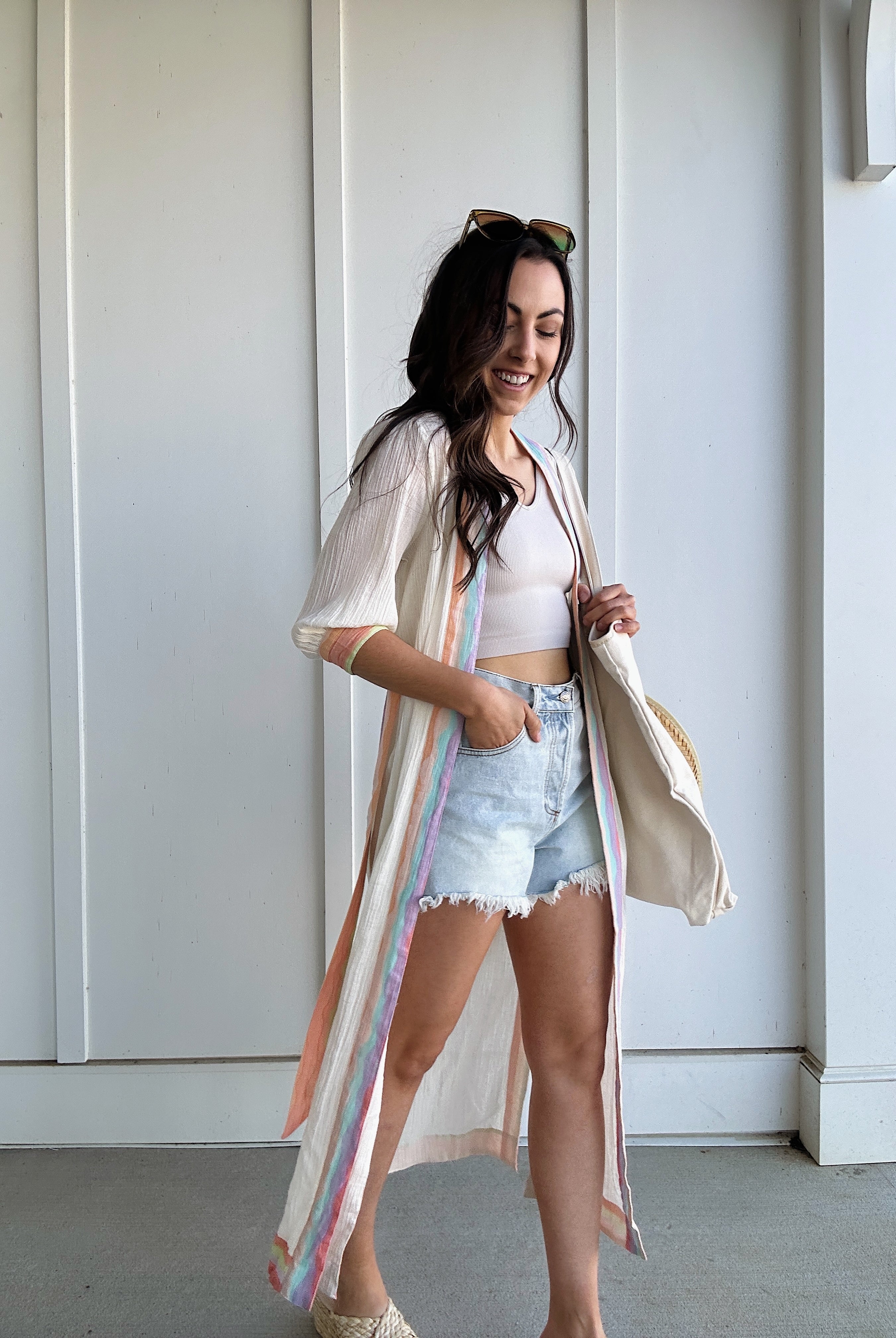 woman wearing colorful duster with side