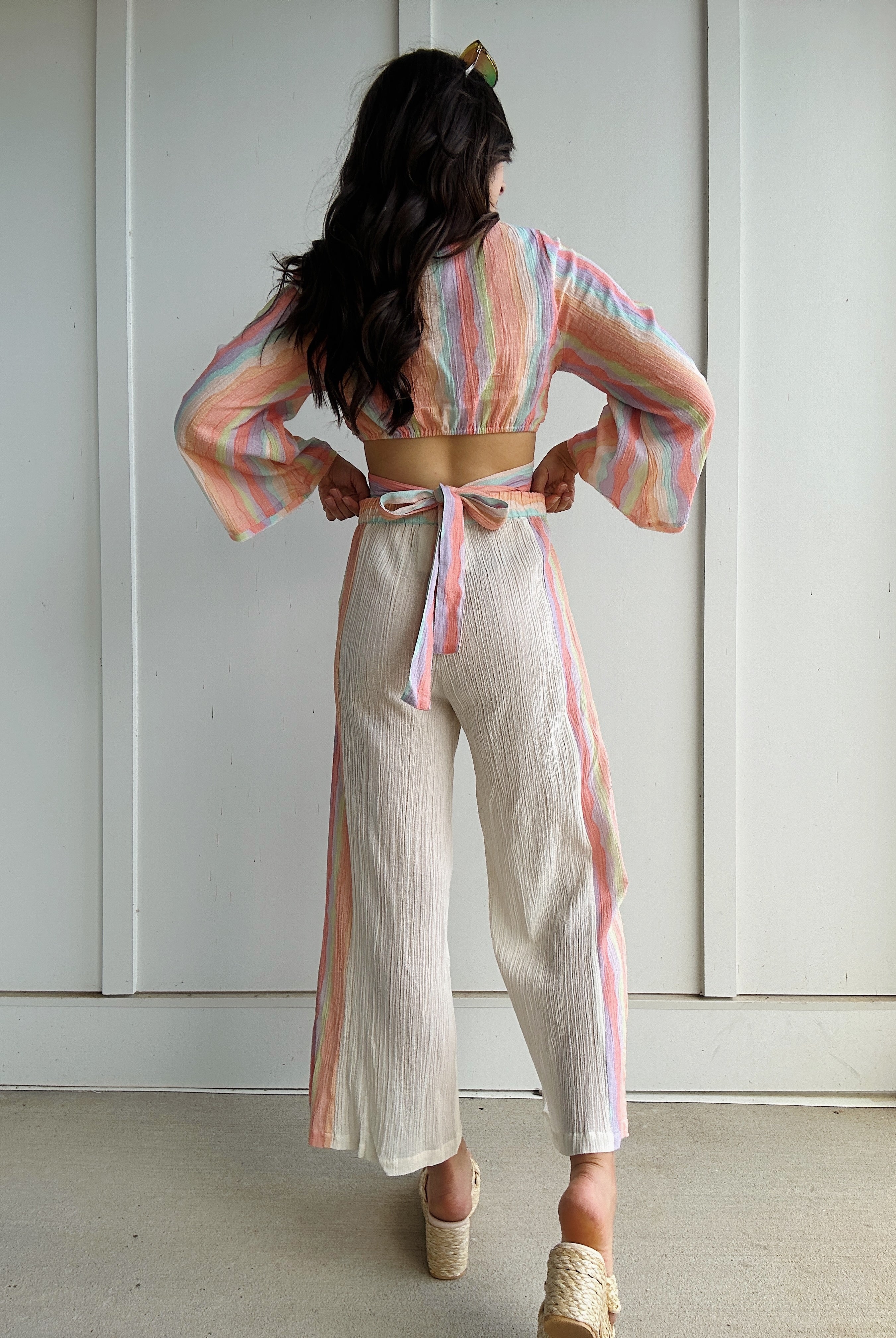 woman wearing colorful outfit from back