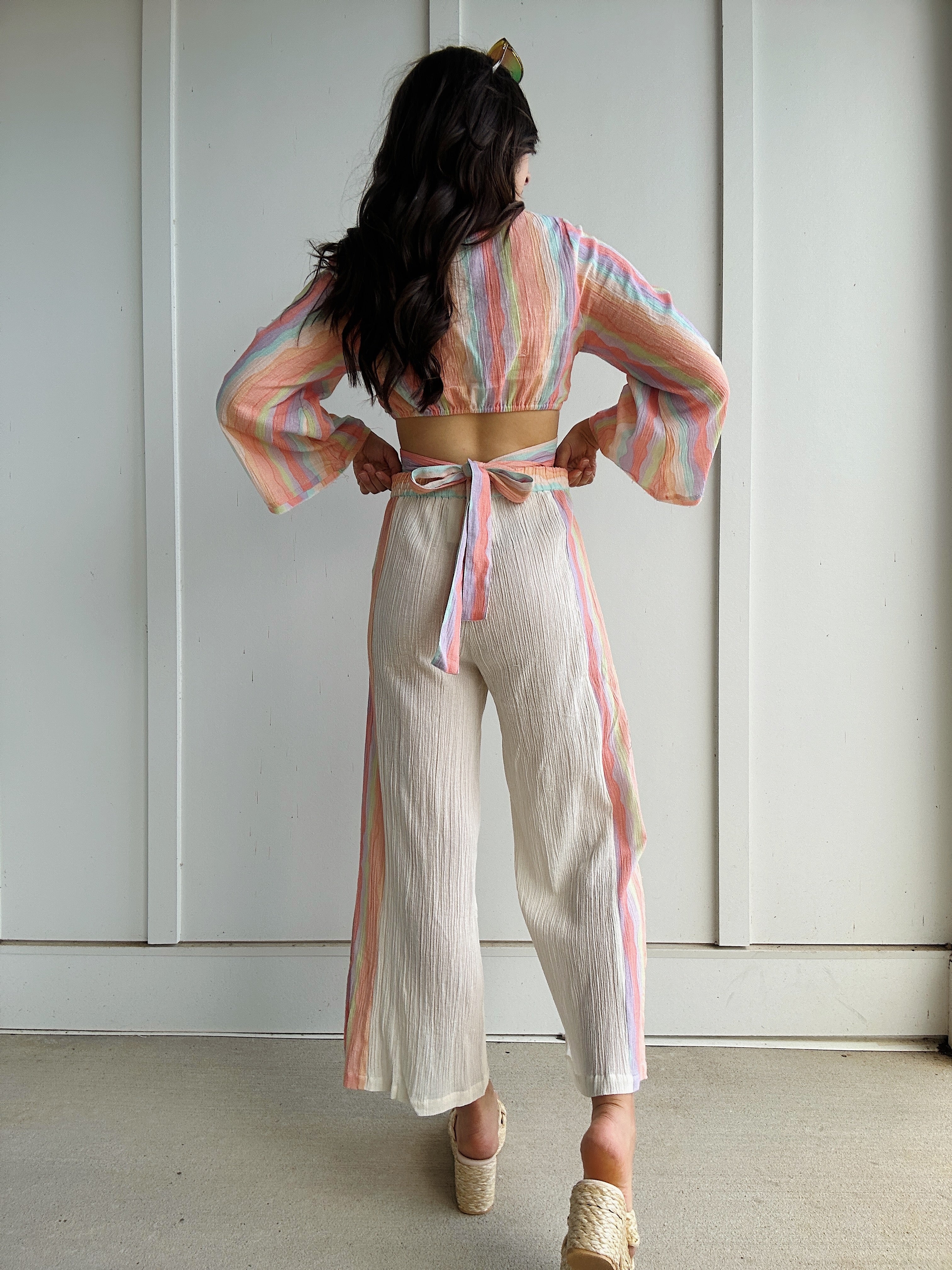 woman wearing colorful outfit from back