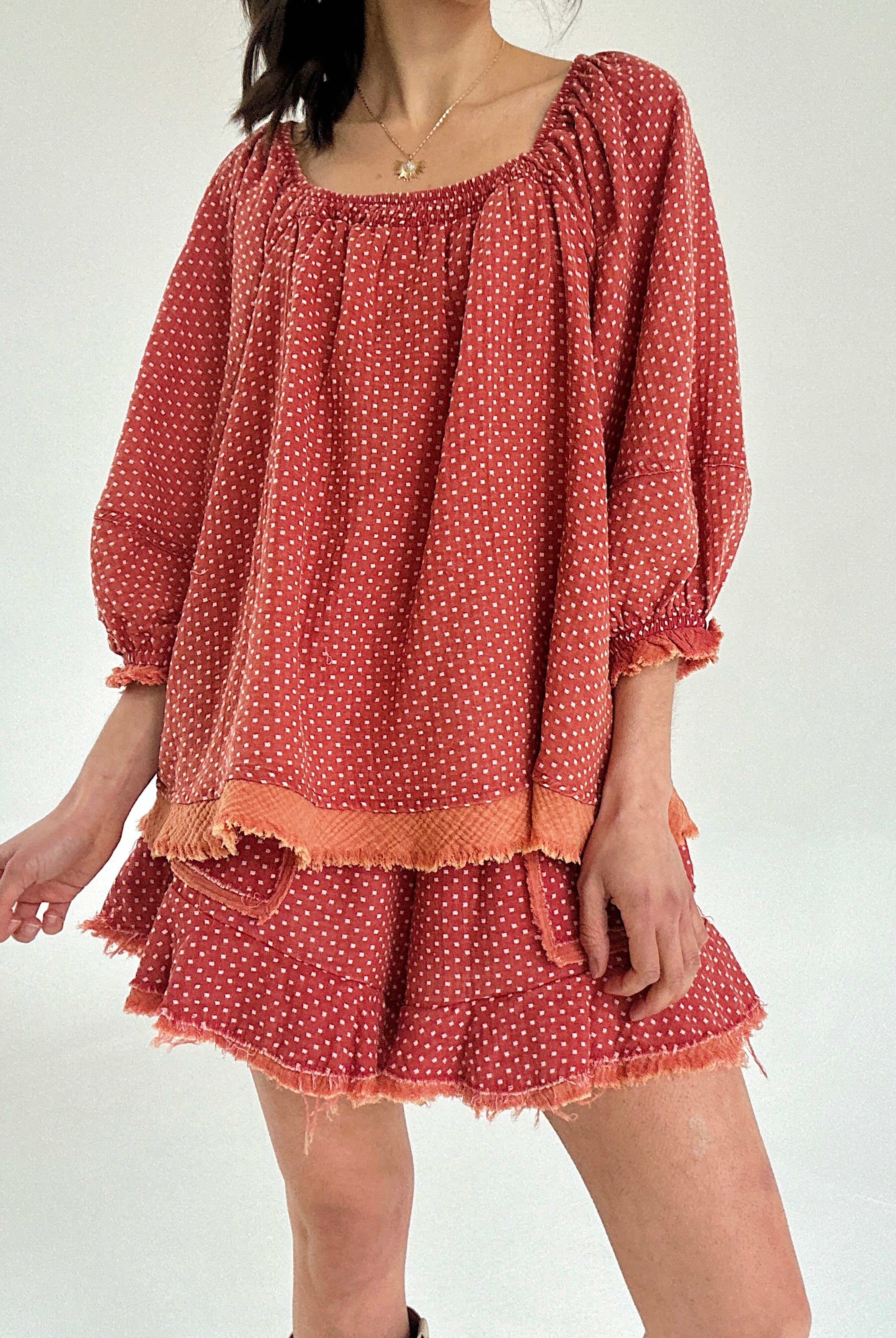 Red polka dot set with long sleeves and shorts on a white background