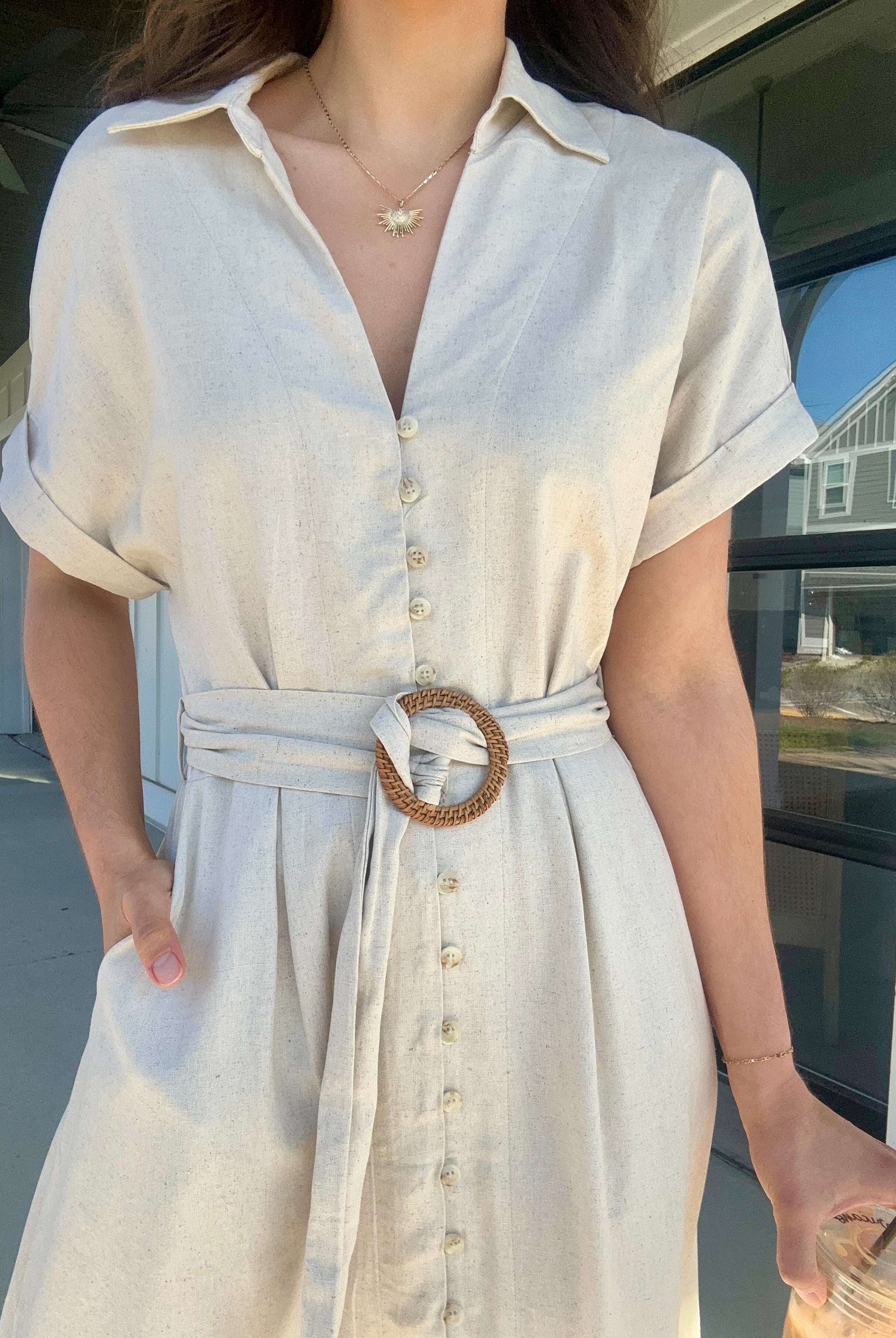 Oatmeal linen dress v-neckline with collar, front buttons, waist belt and side pockets.