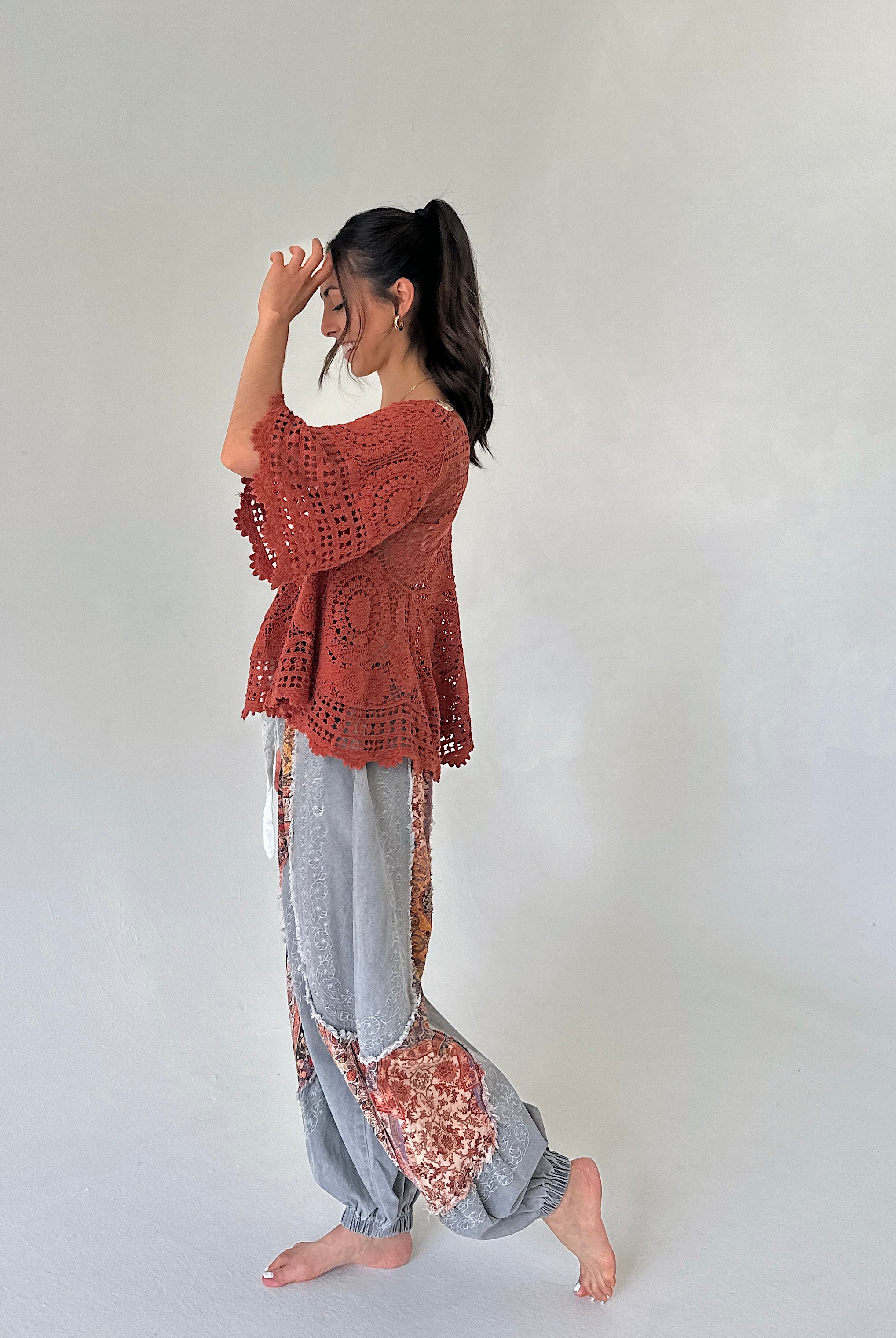 rust knit top with charcoal joggers outit from side