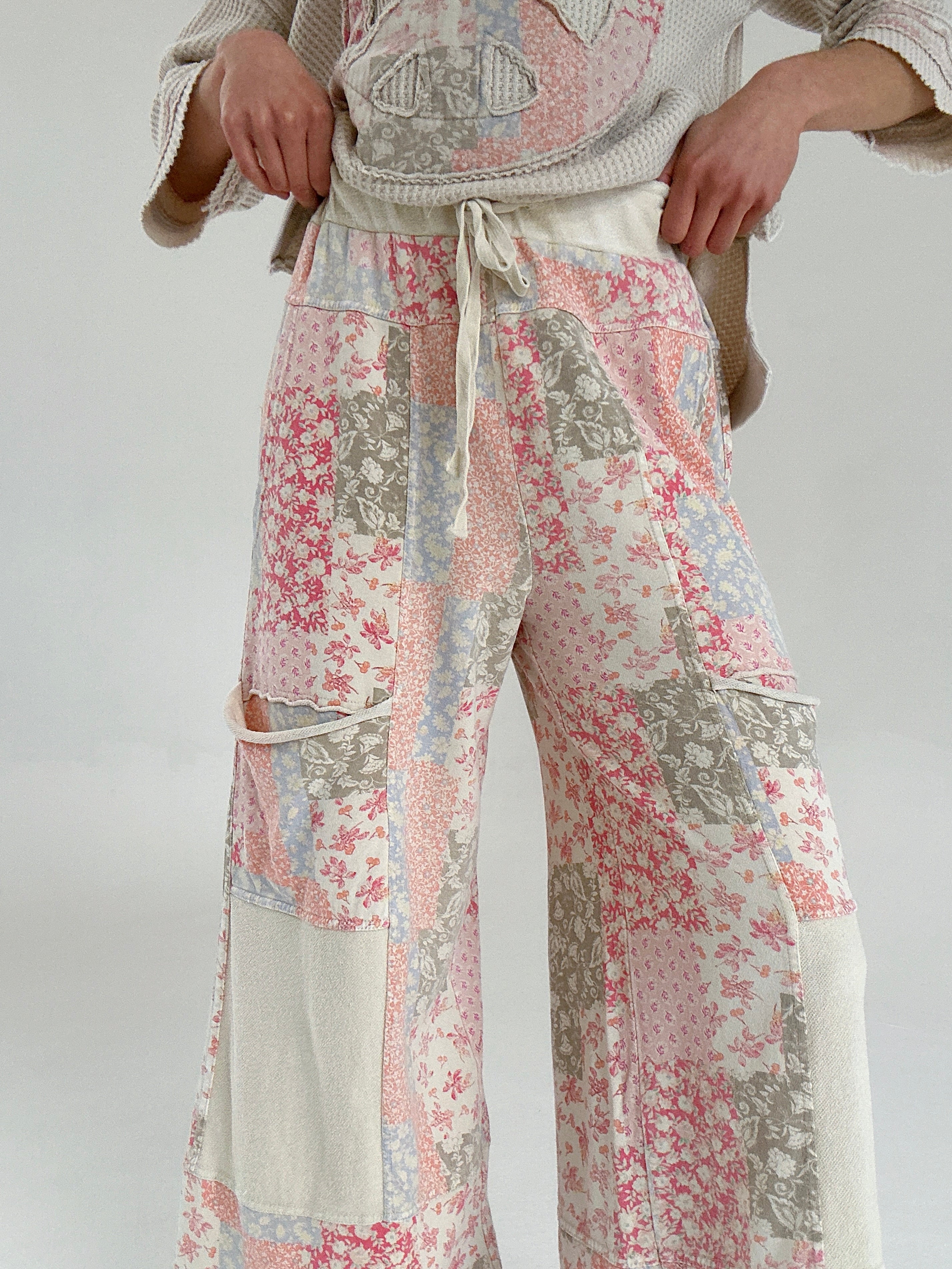 Patchwork floral pants with a neutral background
