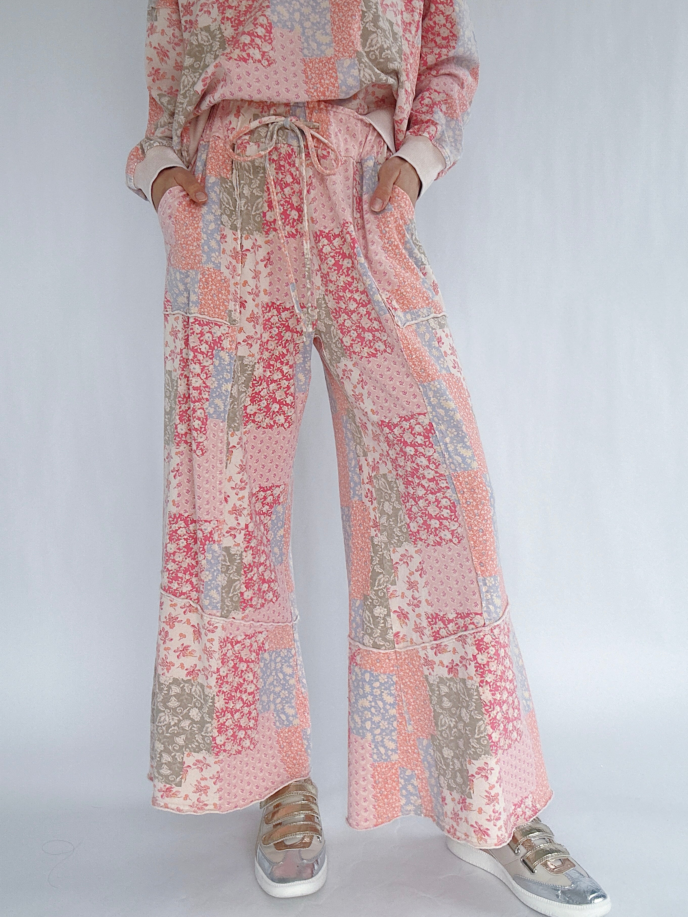 Floral patterned matching outfit with wide-leg pants and a top on a white background
