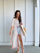 woman wearing duster with colorful trim