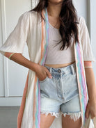 woman wearing duster with colorful stripes