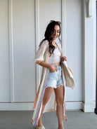 woman wearing colorful duster with side