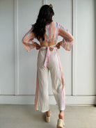 woman wearing colorful outfit from back