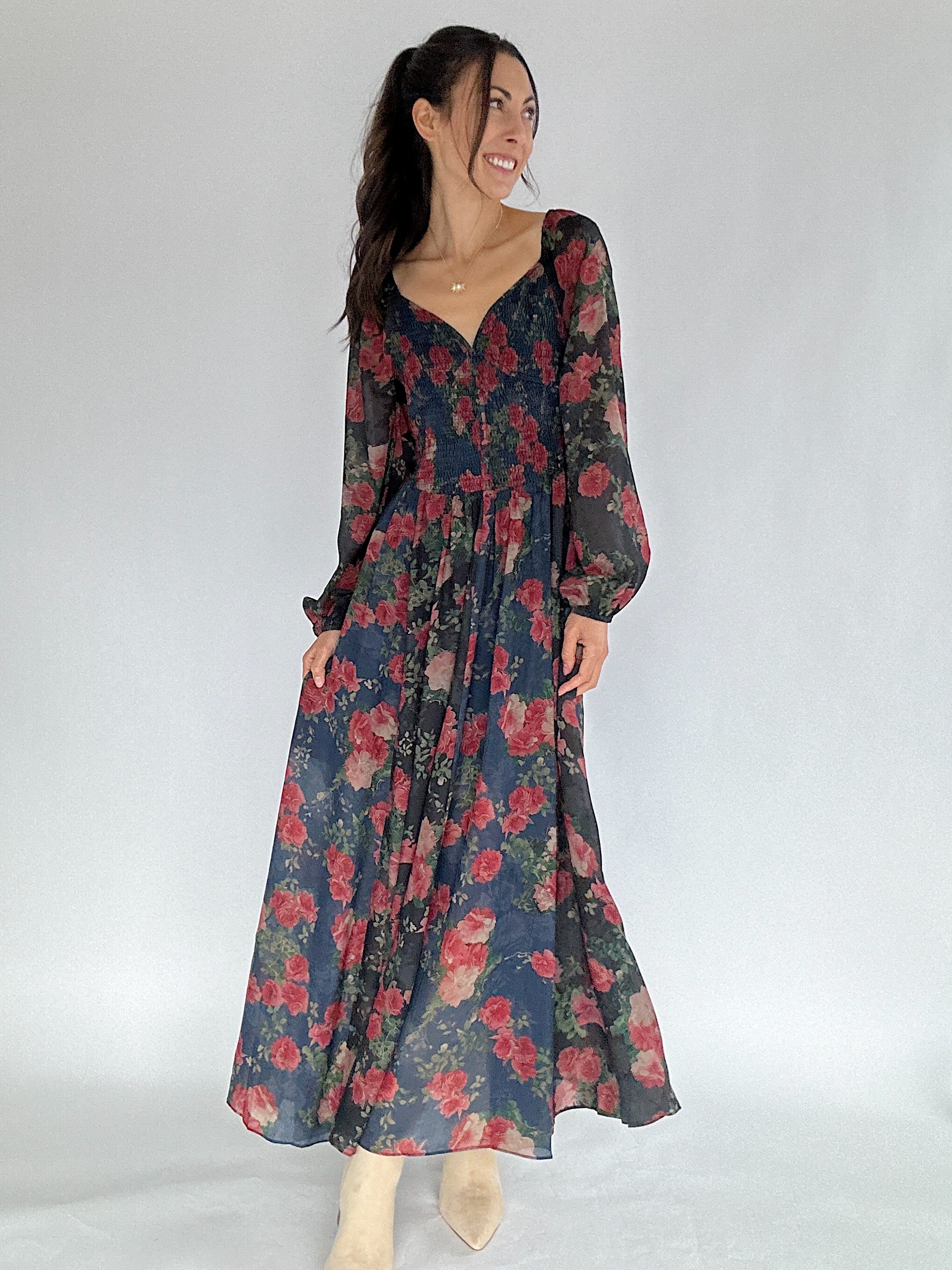 Woman wearing a floral dress on a white background