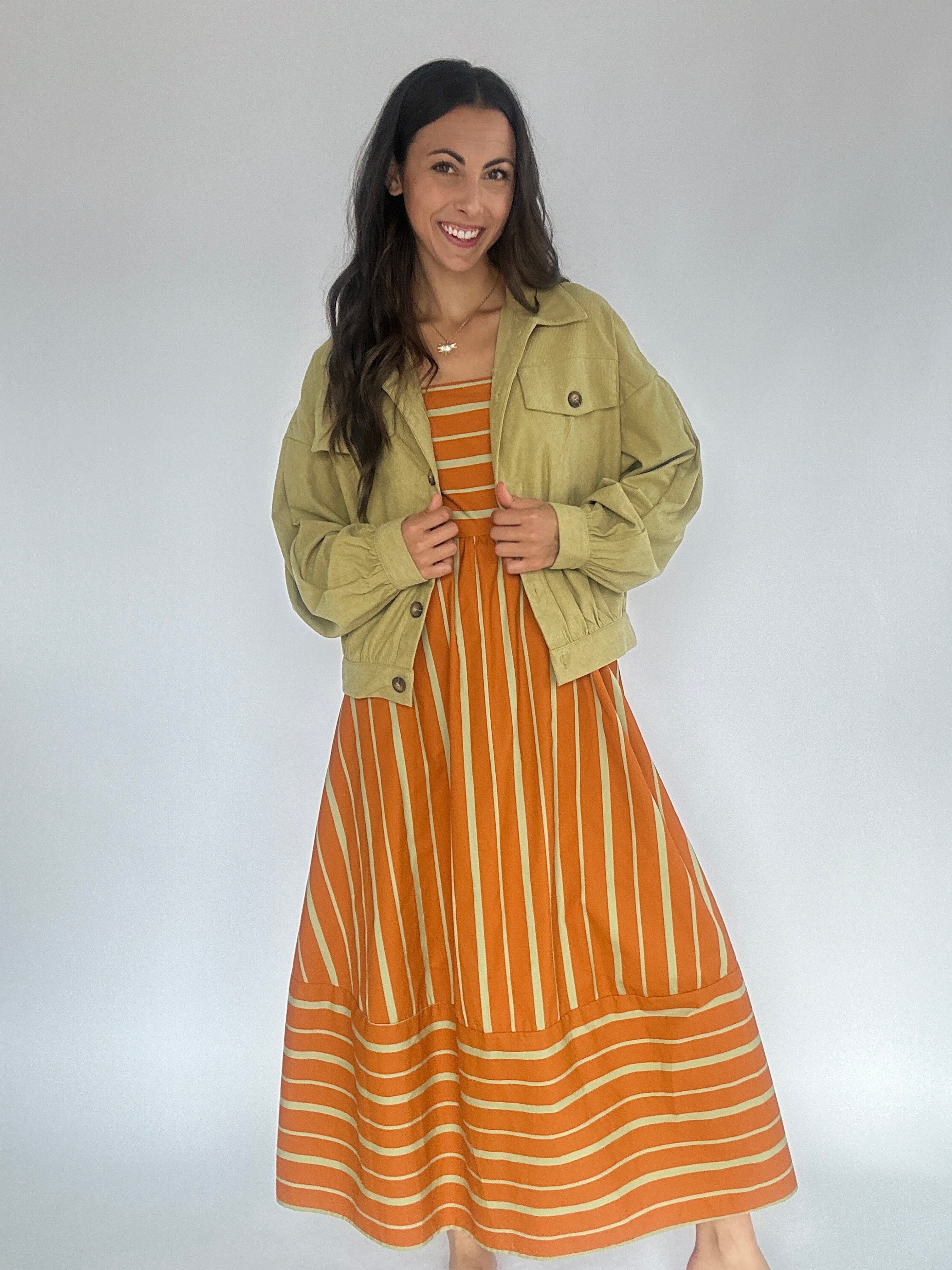 Fault Line Midi Dress Rust With Green Jacket