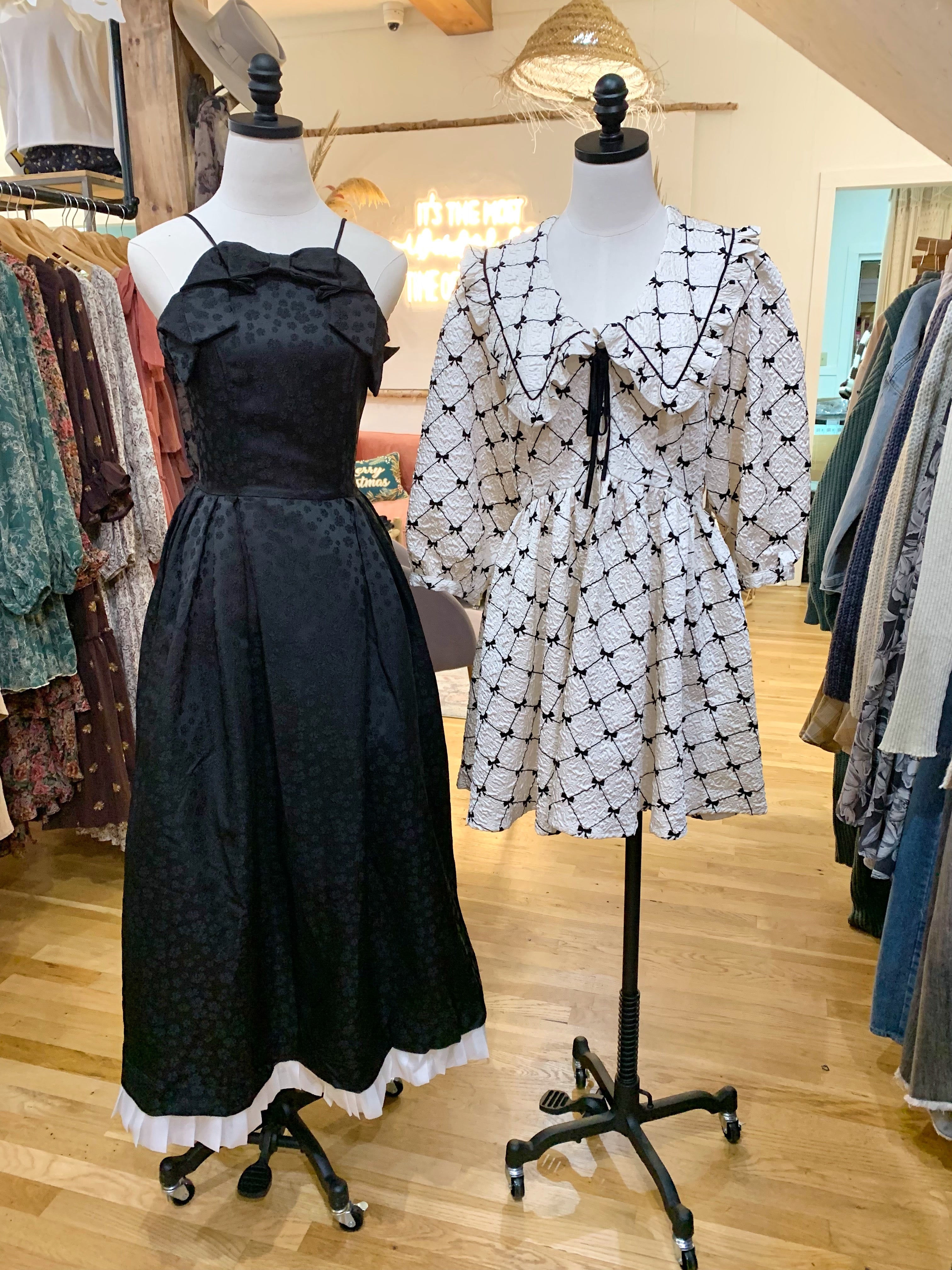 Jacqueline Bow Midi Dress and Love Language Dress On Mannequin