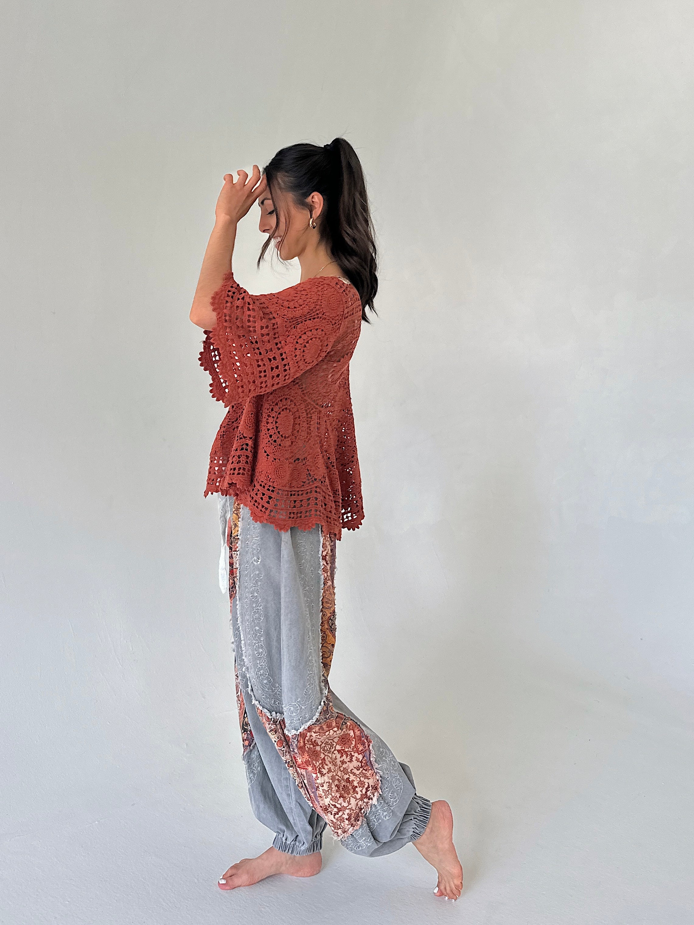 rust knit top with charcoal joggers outit from side