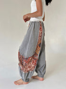 woman wearing charcoal jogger pants with floral accents