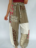 Patchwork pants with floral patterns on a plain background