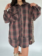 Plaid shirt dress worn by a person on a white background