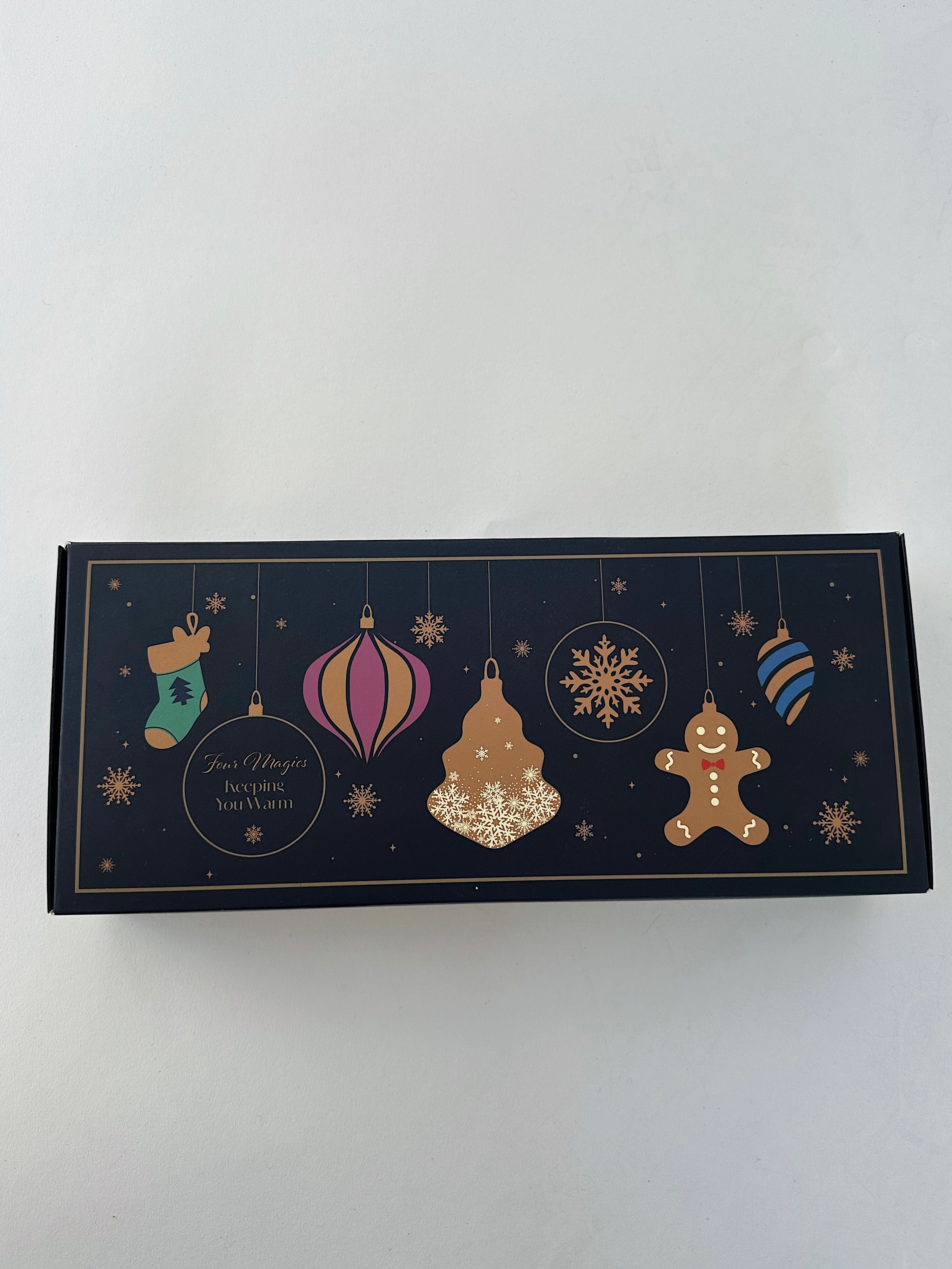 Decorative box with Christmas-themed illustrations on a white background